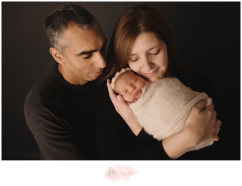 Calgary Newborn Photographer baby girl in mommy's arms family pose